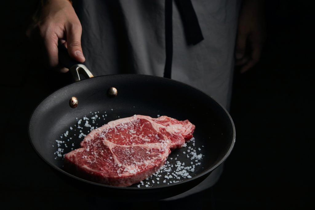 Steak in a non-stick pan.