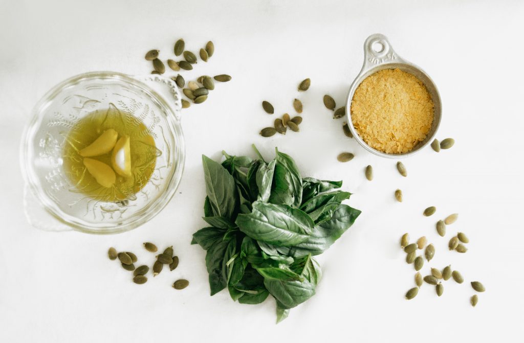 Ingredients for vegan pesto, as seen from above.
