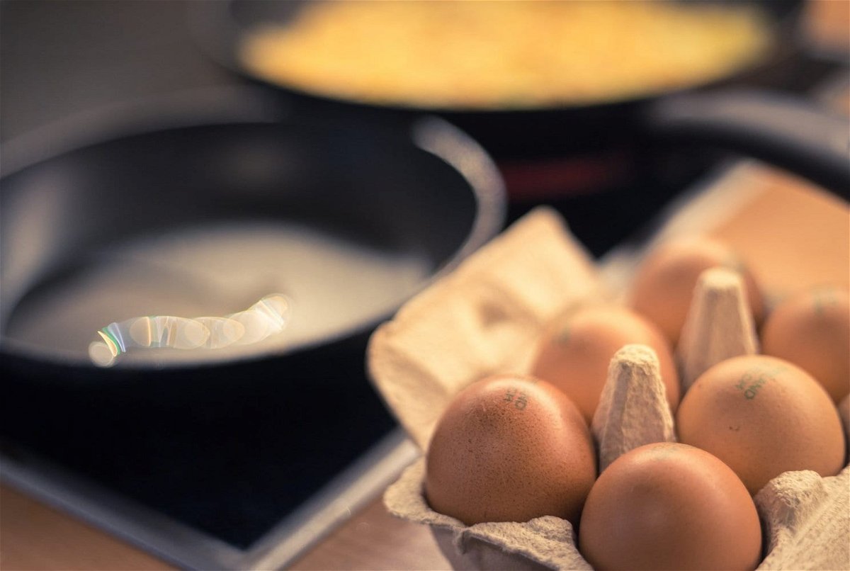Preparing eggs for breakfast.