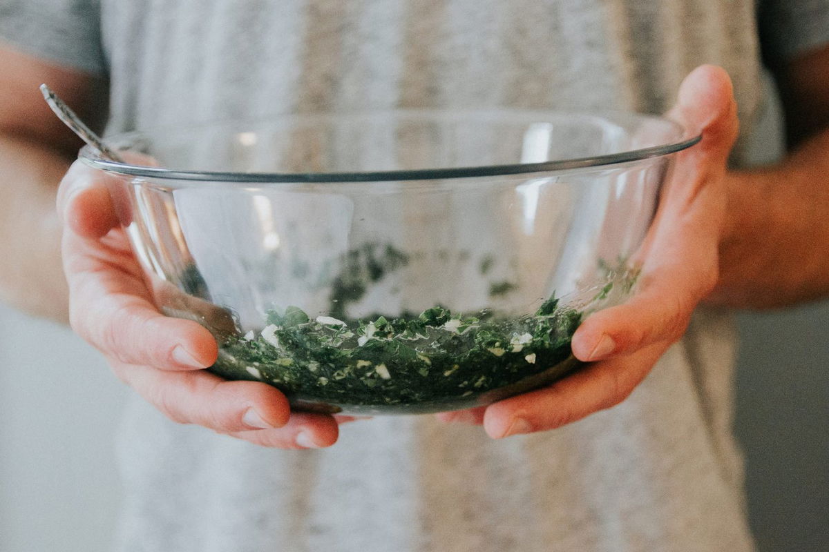 person holding a glass bowl