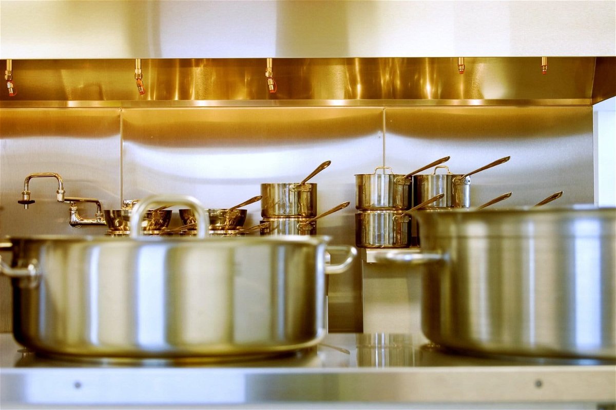Stainless steel pans in a kitchen.