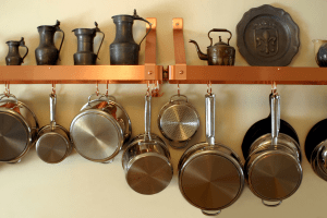 essential cookware on a wall