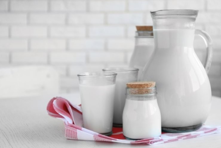 milk in several different jugs and glass