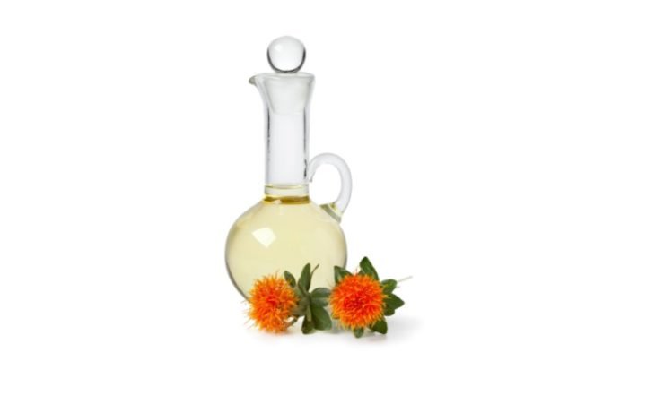 safflower oil in a glass jug