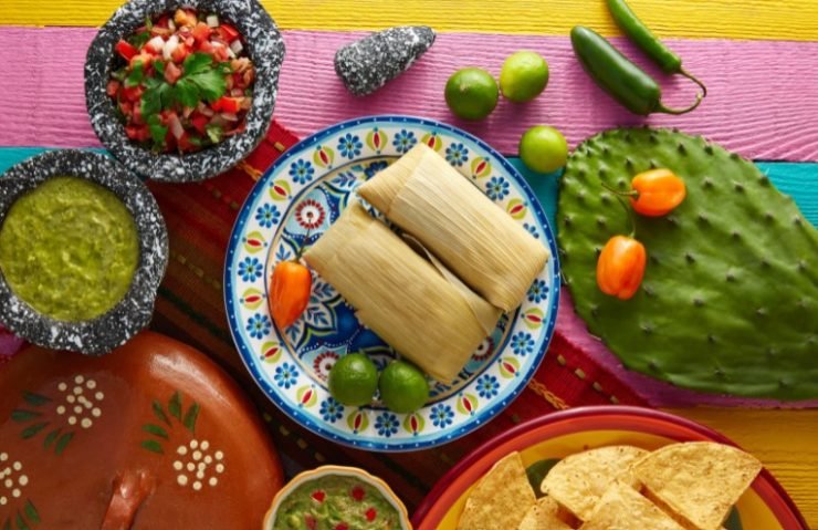 two tamales placed on a blue plate