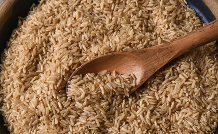 Brown Rice and Wooden Spoon