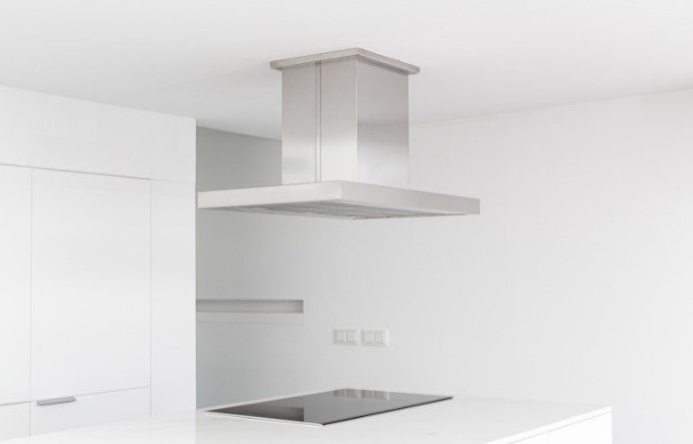 Cooker Hood and Electric Stove of a Modern and Minimalist Kitchen