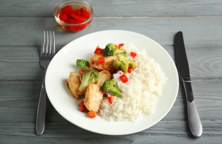 Chicken Stir Fry with Rice and Cutlery on Table