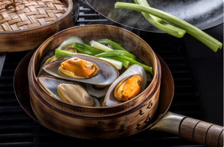 bamboo steamer inside a wok