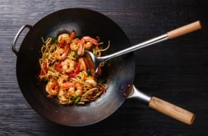 why use a wok instead of a frying pan