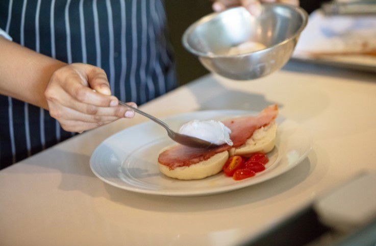 Chef adding sour cream