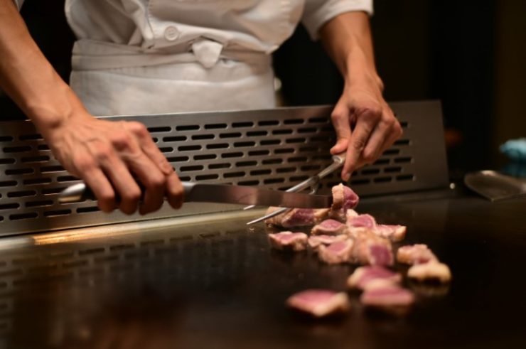 chef making Japanese style BBQ in restaurant