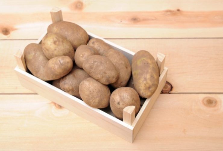 russet potatoes in wooden basket
