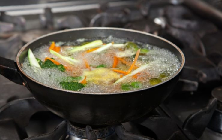 cooking vegetables in a pan