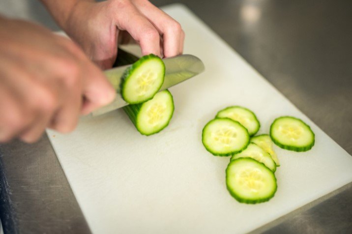 Cucumber cutting on a white board