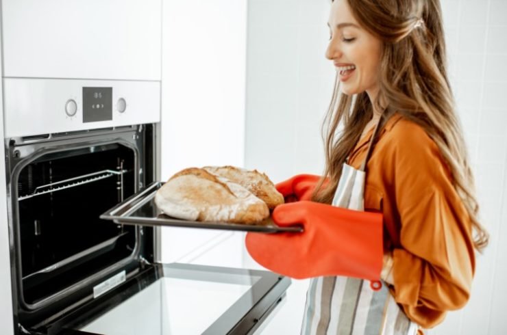 Woman Baking Bread at Home