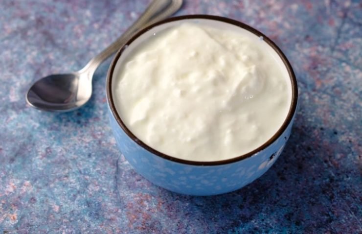 Close up of Fresh Yogurt in a Bowl on Color Background