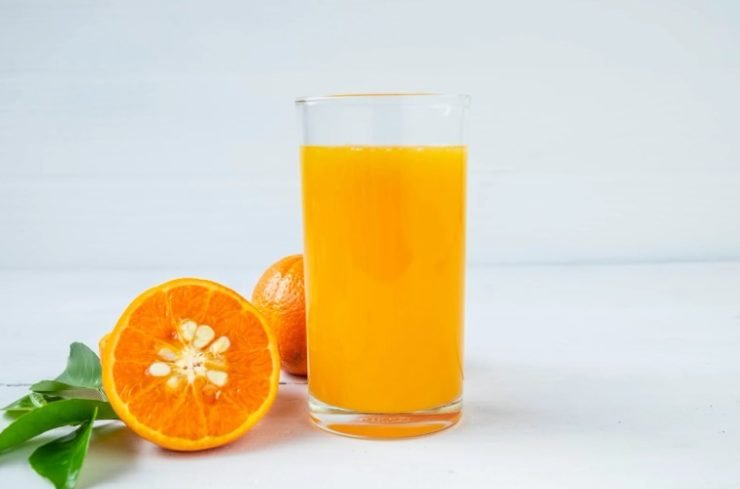 A Glass of Orange Juice and Orange Fruit