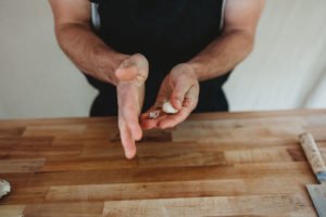 peeled garlic in hands