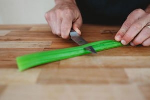 peeling celery with a knife