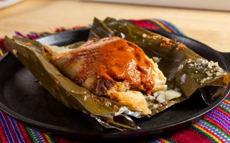 Guatemalan tamal with red chilli sauce