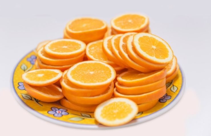 Fresh juicy orange round sliced slices closeup