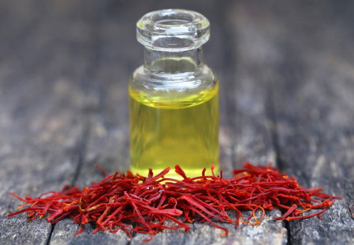 a bottle of safflower oil sitting on a table