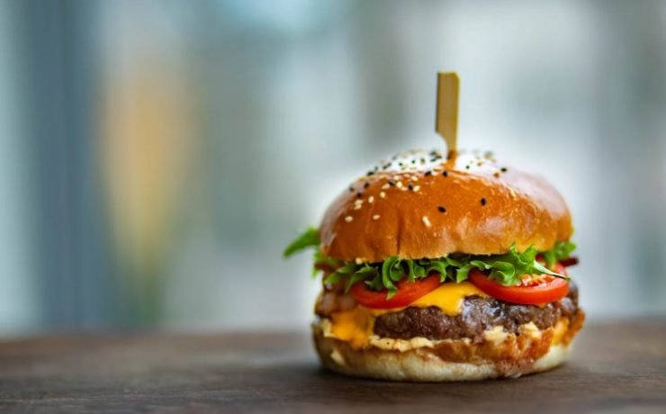 Juicy Burger on Wooden Surface