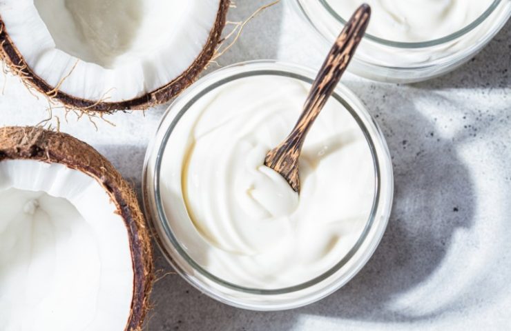 Vegan Coconut Yogurt in Glass Jars, White Background, Top View.