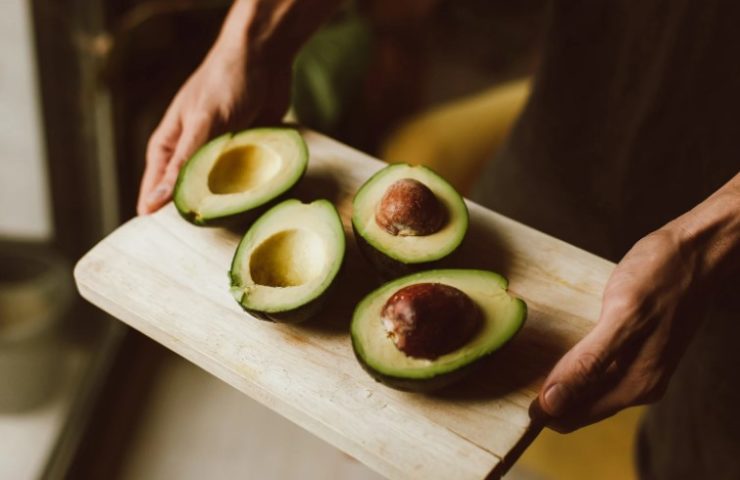 Sliced Avocado on Brown Wooden Chopping Board