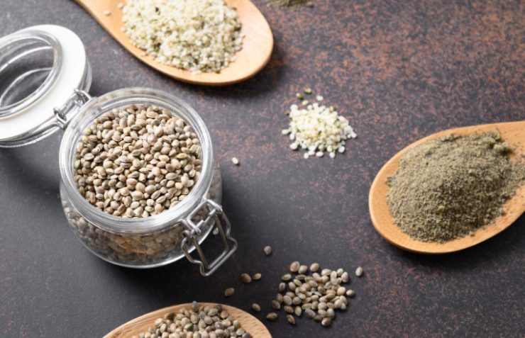 Hemp Seeds in Glass Jar on Brown. Close up