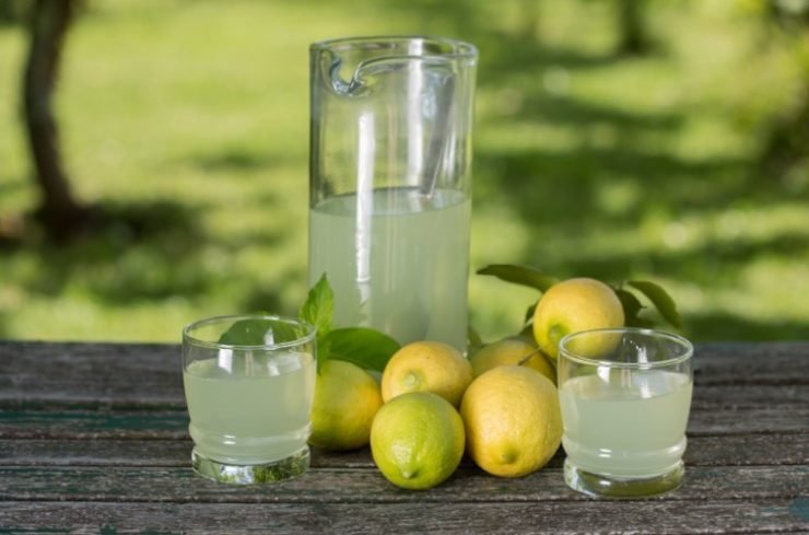 jug and glasses with lemon juice