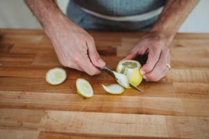 peeling lemon with knife