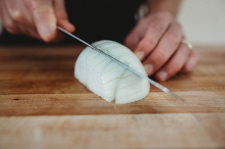 cutting onion half