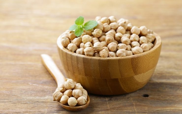 Raw Chickpeas in a Wooden Bowl