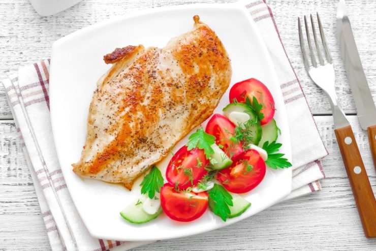 food and salad on a white plate