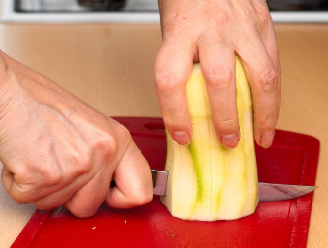 cutting vegetable on a cutting board