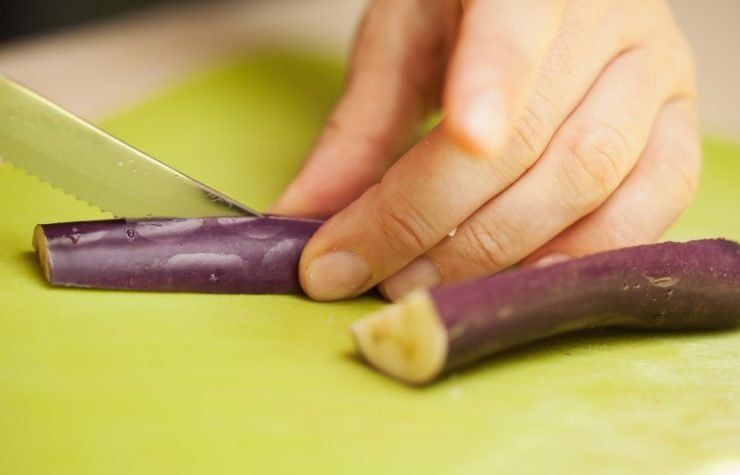 cutting vegetable on a cutting board
