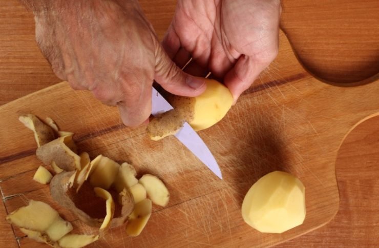 Peeling potatoes with a knife