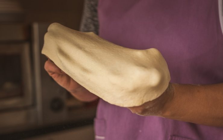 Stretching pizza dough