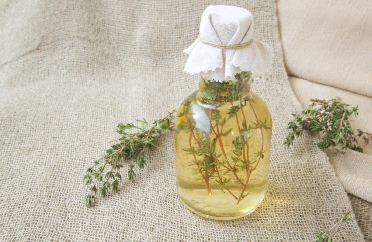 bottle on a rug and plant inside