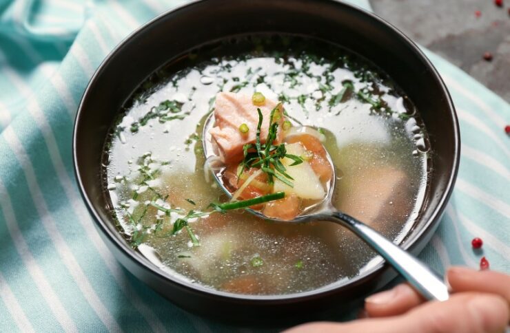 Woman Eating Tasty Fish Broth, Closeup