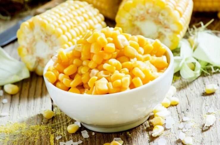 Canned sweet corn in white bowl