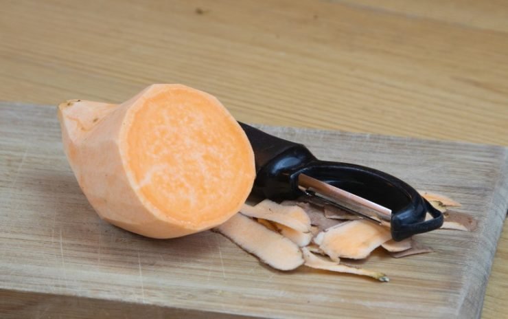 Peeled Sweet Potato on Bamboo Chopping Board